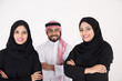 © Mahmoud Rahall - Two arab females with one male smiling and standing on white background