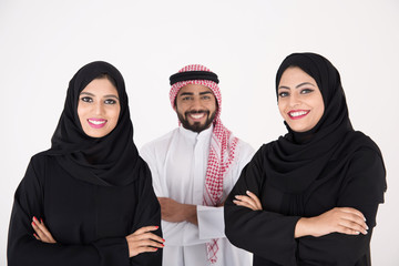 Poster - Two arab females with one male smiling and standing on white background