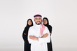 © Mahmoud Rahall - Two arab females with one male smiling and standing on white background