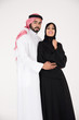 © Mahmoud Rahall - Arab couple standing on white background