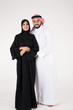© Mahmoud Rahall - Arab couple standing on white background