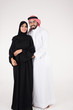 © Mahmoud Rahall - Arab couple standing on white background