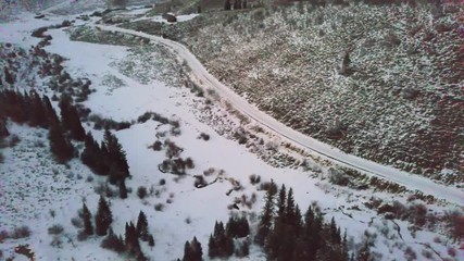 Affiche - Aerial view of rural mountain community at sunset  in the Winter.