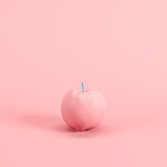 Wall Mural - Apple painted in pink with blue stem isolated on pastel pink backgound. Minimal fruit idea concept.