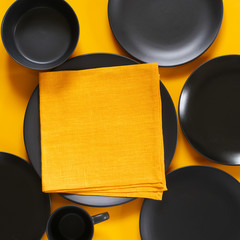 Poster - Set of black tableware on yellow