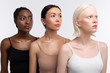 Three women with different skin color wearing camisoles