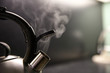 kettle with boiling water. whistle on a boiling kettle closeup. steam from the kettle through the opened whistle. spout of kitchen kettle