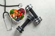 © New Africa - Flat lay composition with bowl of heart-healthy diet products and space for text on grey background