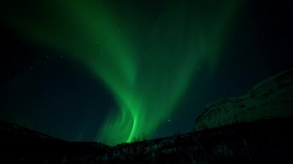 northern light (aurora borealis) over a mountain