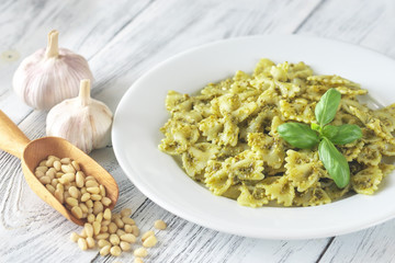 Wall Mural - Portion of farfalle with pesto with ingredients