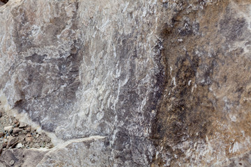 Wall Mural - Gray-beige stone texture. Rock. Stone background. Relief surface. Beautiful natural pattern on the plane. Raster image