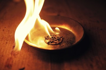 Old pentagram burning in flames