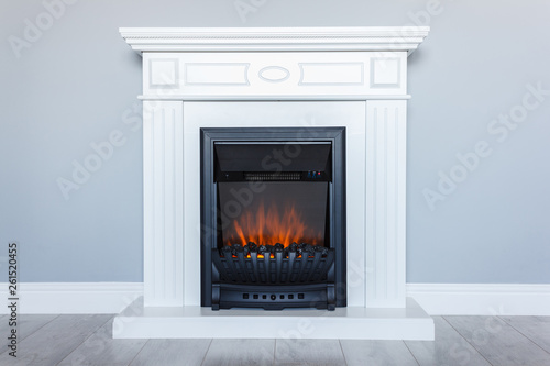 White Wooden Decorative Electric Fireplace With A Beautiful