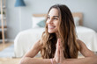 © BestForYou - Portrait attractive smiling yogi woman in meditating pose, relaxation exercise, working out, wearing sportswear.