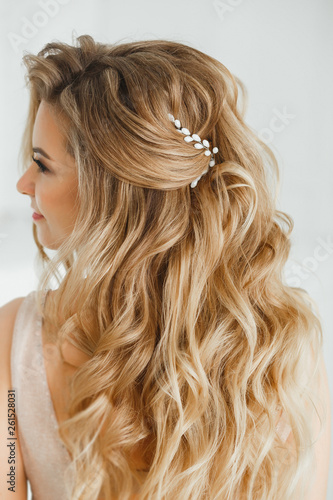 Beautiful Blonde Woman Showing Her Perfect Greek Hairstyle