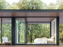 Modern Bedroom In Glass House 3d Render, There Are Black Steel Structure,wooden Floor And Ceiling,decorated With White Furniture,surrounded By A Large Green Garden.