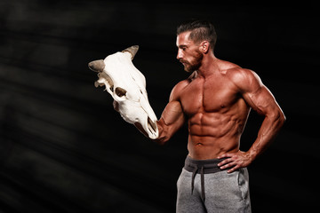 Wall Mural - Minotaur, Muscular Men holding Bull Skull