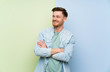 © luismolinero - Redhead man over colorful background happy and smiling