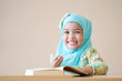 © Asada - Happy Muslim kid during Quran during ramadan month.