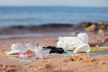 Garbage On The Beach. Environmental Pollution Concept