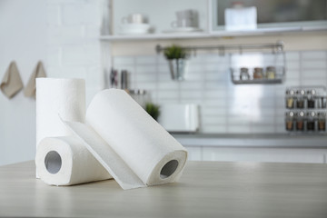 Wall Mural - Rolls of paper towels on table in kitchen. Space for text