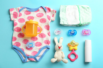 Wall Mural - flat lay composition with baby accessories on color background