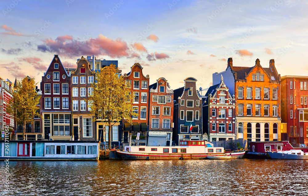 Obraz na płótnie Amsterdam Netherlands dancing houses over river Amstel landmark in old european city spring landscape. w salonie