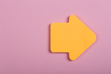 Business, Future And Motivation Concept - Orange Blank Sticker In The Shape Of An Arrow On Wooden Background