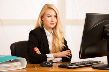 Sticker - Beautiful young blonde woman working on computer in her office