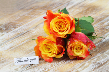 Wall Mural - Thank you card with colorful roses covered in glitter on wooden surface