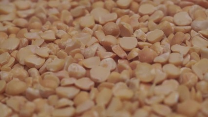Poster - Chopped dried peas background. Macro view. Rotation 360 degrees.