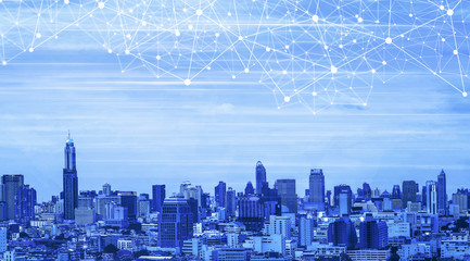 Wireless network connection technology icons over city.