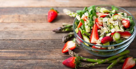 Wall Mural - Healthy asparagus salad with strawberries