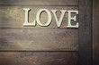 © alexkich - word Love from wooden letters on background