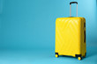 Stylish suitcase on color background. Space for text