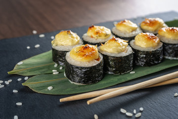 eight rolls on a slate Board, on bamboo leaves