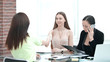 © yurolaitsalbert - handshake of young business partners at a working meeting in the office