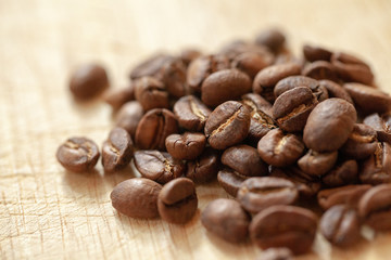 Coffee seed on wooden plate