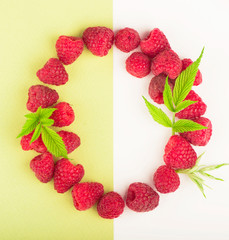 Poster - wreath made of raspberries on white background