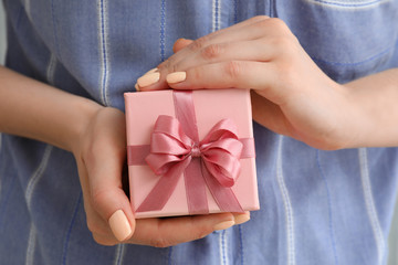 Woman with beautiful gift, closeup