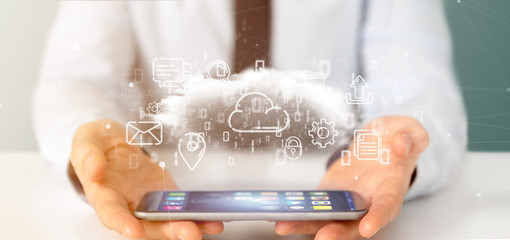 Businessman holding a Cloud of multimedia icon 3d rendering