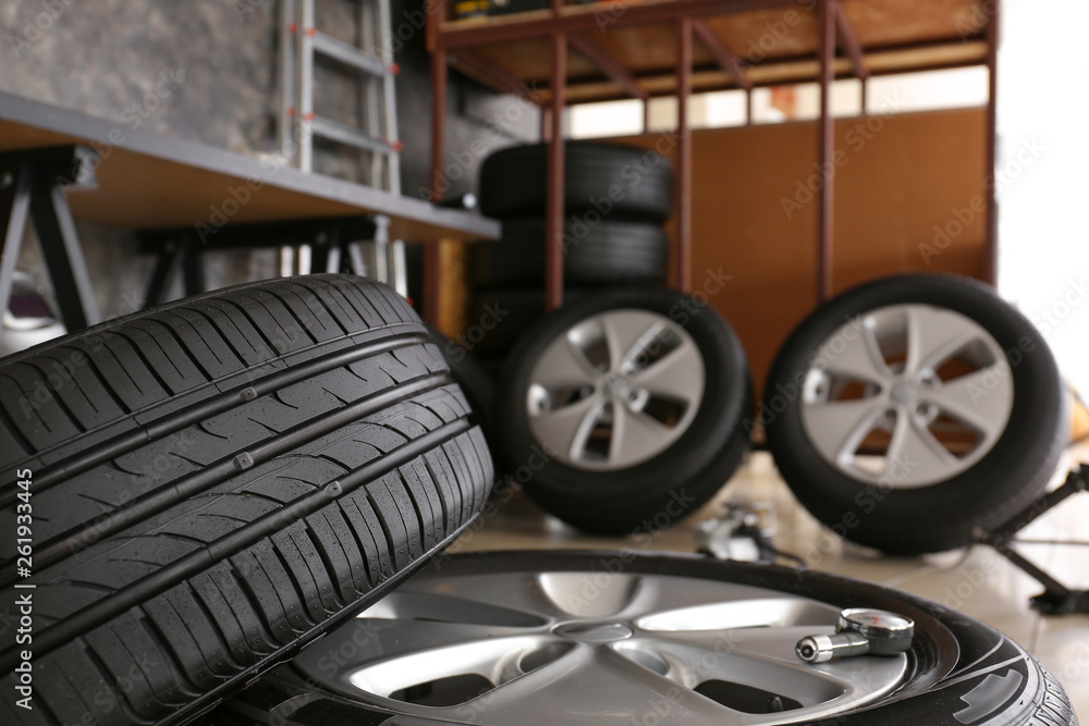 Car tires in automobile service center, closeup