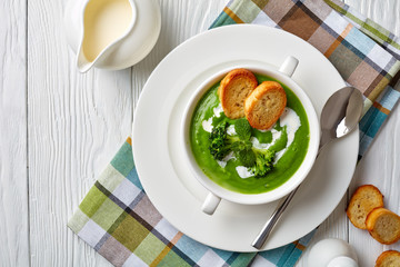 Poster - broccoli cream soup in a white bowl