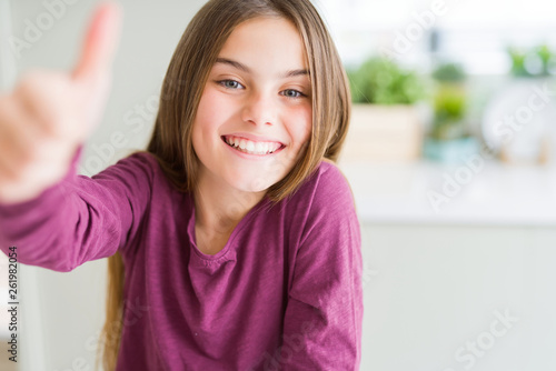 Beautiful Young Girl Kid Doing Happy Thumbs Up Gesture With Hand