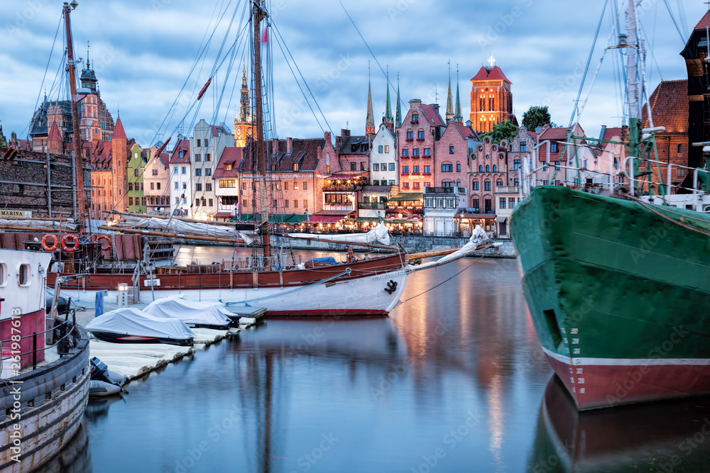 Downtown of Gdansk with boats in harbor during evening,Poland - obrazy, fototapety, plakaty 