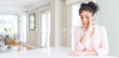 © Krakenimages.com - Wide angle of beautiful african american woman with afro hair hand on mouth telling secret rumor, whispering malicious talk conversation