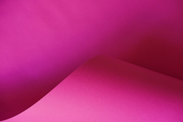 Abstraction of a design pink paper. Empty space on monochrome paper.