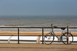 Parked bicycle on a fence near the sea in Middelkerke
