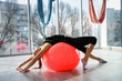 © RomanR - Woman in gym working with gymnastic ball