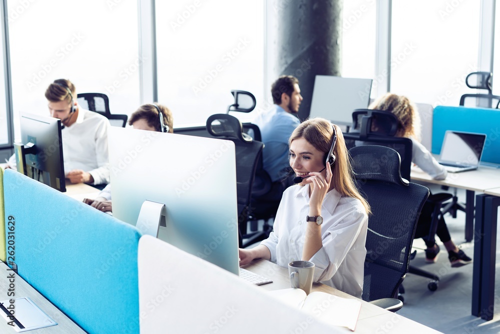 Colleagues working in a call center. Stock Photo | Adobe Stock